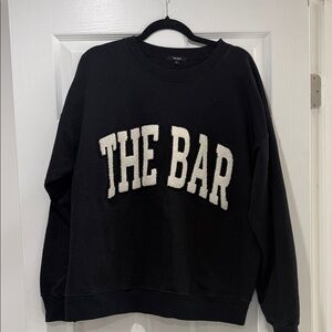 Black The Bar sweater White Sherpa lettering. Size Large